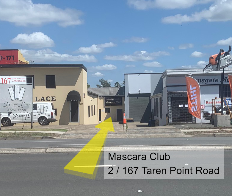 A view of 167 Mascara Club from the street in daylight